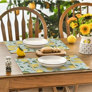 Summer lemon pattern placemats on walnut table for kitchen party and home decoration