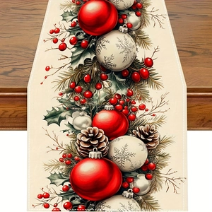 Chemin de table de Noël détaillé avec boules rouges et pommes de pin sur tissu blanc