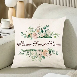 Housse de coussin fleurs Home Sweet Home en lin sur canapé avec déco chaleureuse
