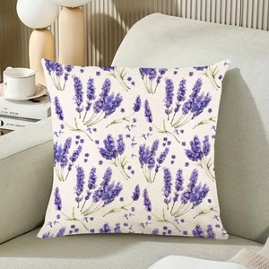Lavender floral linen pillow cover on a beige sofa in a cozy living room setting