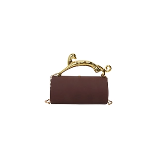 Dark brown cylindrical acrylic evening bag featuring a gold leopard handle and chain