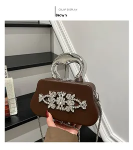 Brown box evening bag with silver metal handle and crystal flower cluster detail