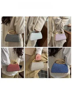 Showcase of six colorful rhinestone clutch bags with metal handles and chain straps