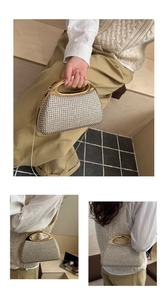 Detailed close-up of champagne gold rhinestone evening bag with chain and handle