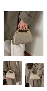 Close-up of golden evening clutch with rhinestones and unique integrated metal handle