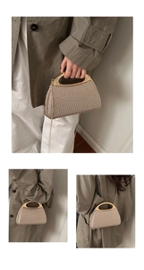 Close-up of sparkling rhinestone evening bag with gold handle and chain shoulder strap