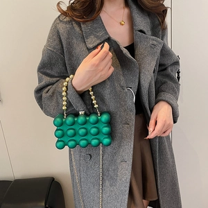 Green bubble texture acrylic clutch bag with gold bead handle and metallic chain strap