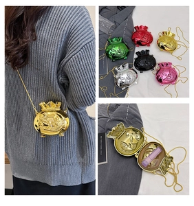 Detailed views of mini lucky bag acrylic cross-body bag with gold chain and interior space