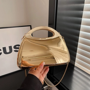 Chic gold mirror acrylic handbag with oval cutout handle and metal chain strap