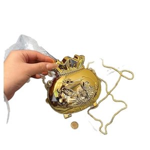 Golden fish shaped acrylic evening clutch with koi relief and elegant chain strap
