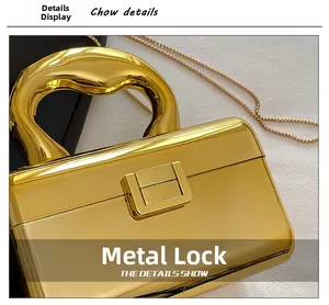 Detailed view of glossy gold metallic evening clutch with a secure rectangle hardware lock