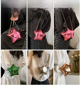 Model wearing a stylish star-shaped metallic crossbody bag with a delicate chain strap