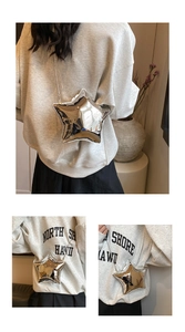 Detail of silver star-shaped crossbody bag with mirror finish and metal chain strap
