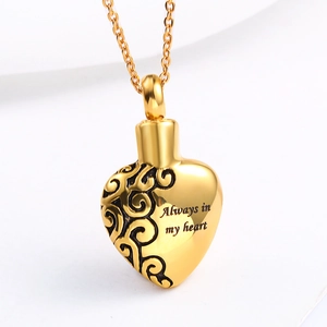 Gold heart-shaped cremation urn necklace with 'Always in my heart' vine engraving