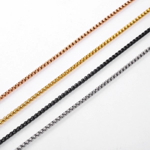 Detail of stainless steel box chains in rose gold, gold, black, and silver finishes