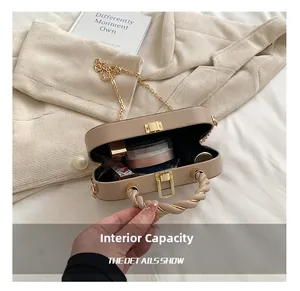 Detail showing internal capacity of milk tea crossbody bag with lipstick and cosmetics