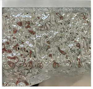 Macro shot of silver liquid metallic fabric with water ripple texture on box handbag