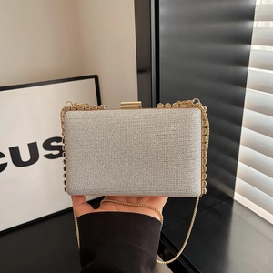Chic silver sparkly evening clutch bag with rhinestones and gold chain strap