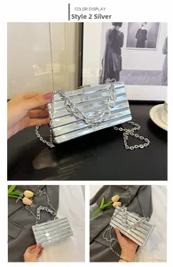 Detailed view of silver striped box clutch bag with metallic texture and chain straps