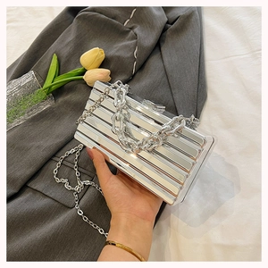 Silver striped box clutch bag with metallic mirror finish and chunky chain handle detail