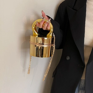 Glossy golden cylindrical acrylic box bag with metallic handle and chain strap for women