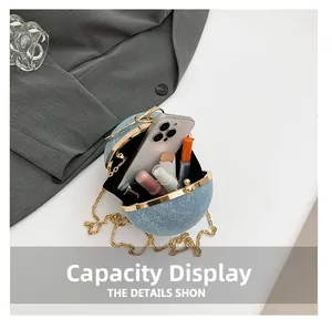 Capacity display of light blue spherical evening bag with gold chain and interior space