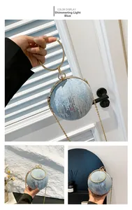 Detail of sequin light blue spherical evening bag with gold ring handle and chain