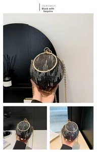 Macro view of sequin black sphere evening bag with gold ring handle and metal chain