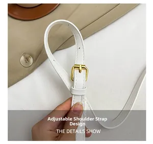 Adjustable white leather shoulder strap detail with premium gold metal buckle for bags