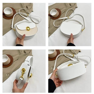 Detail of white PU leather and straw woven crossbody bag with gold round metal buckle