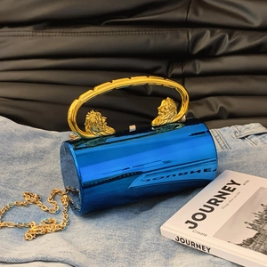 Blue acrylic cylindrical evening clutch with gold lion head handle and chain strap