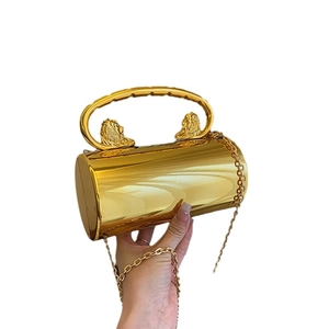 Luxury gold cylinder acrylic clutch bag with lion head relief and gold chain strap