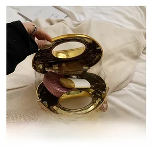 Detailed interior of a gold shell clutch showing space for lipstick and makeup