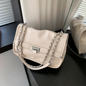 Chic beige lychee leather messenger bag with silver chain strap and metal swivel lock
