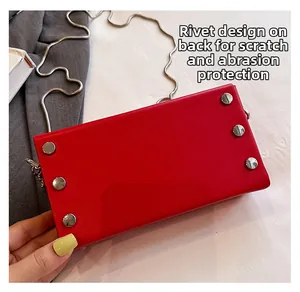 Detail of red leather bag back with six silver rivets and scratch-resistant texture