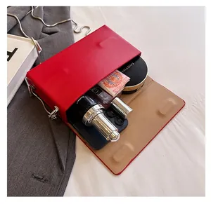 Interior detail of red leather crossbody bag showing spacious capacity for daily essentials