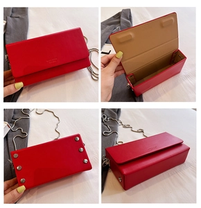 Detail view of red leather flap bag with silver rivets, chain strap and interior layout