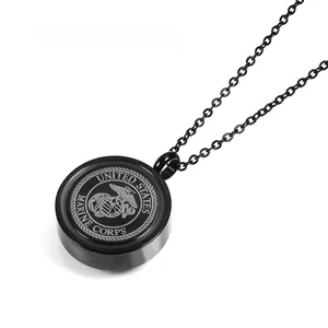 Detail of black US Marine Corps eagle globe and anchor crest on a steel cremation pendant