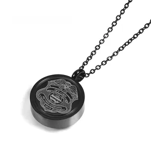 Detail of black urn necklace featuring engraved Reynoldsburg Ohio Police badge on pendant