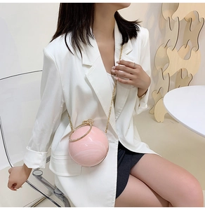 Pink marble pattern spherical clutch bag with gold ring handle and metal chain strap