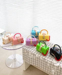 Mini candy-colored fashion handbags in seven colors with acrylic chains and gold accents