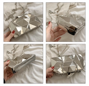 Macro view of silver geometric 3D cut evening clutch bag showing multiple angles