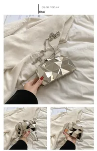 Detail of silver geometric clutch showing mirror reflection and 3D cubic facet design