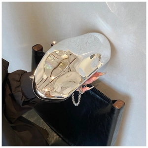 Detail of liquid metal crossbody bag with mirror silver finish and chain strap