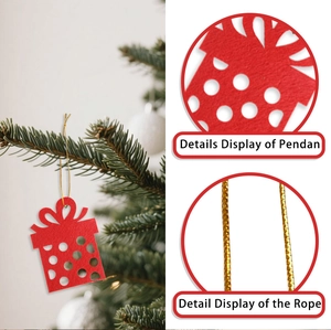 Detail of red felt Christmas gift box ornament with white dots on a tree branch
