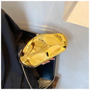 Golden irregular geometric clutch bag with liquid metal mirror finish and chain strap