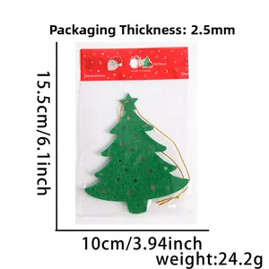 Detail of green felt Christmas tree ornament in clear packaging with santa header card