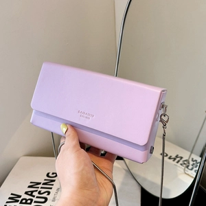 Minimalist lavender square crossbody bag with silver chain strap and brand logo