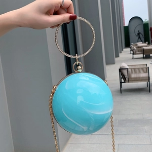 Blue marble spherical evening handbag with gold rhinestone circular handle and chain