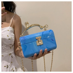 Blue marble acrylic clutch bag with gold leopard handle and chain shoulder strap detail